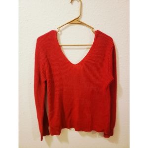 Red off the shoulder sweater.